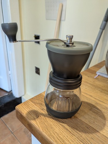 Hario ceramic burr hand coffee - hand,